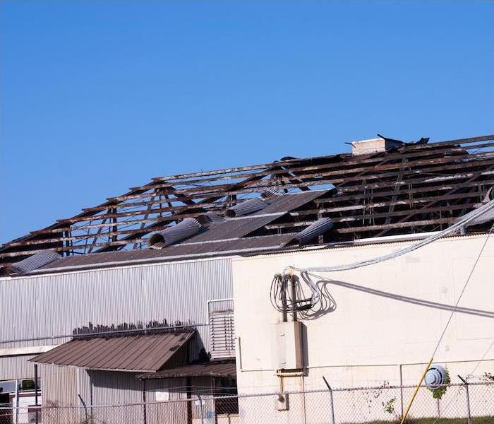 a large commercial building with extensive fire damage to roof